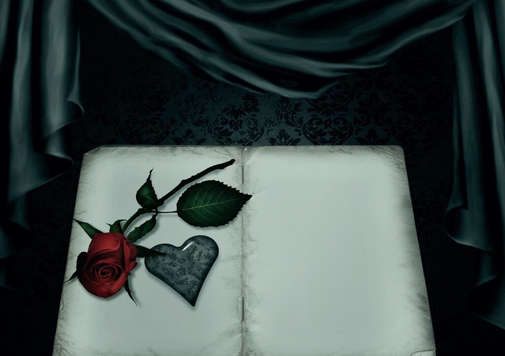 A book and a rose with heart-shaped leaves
